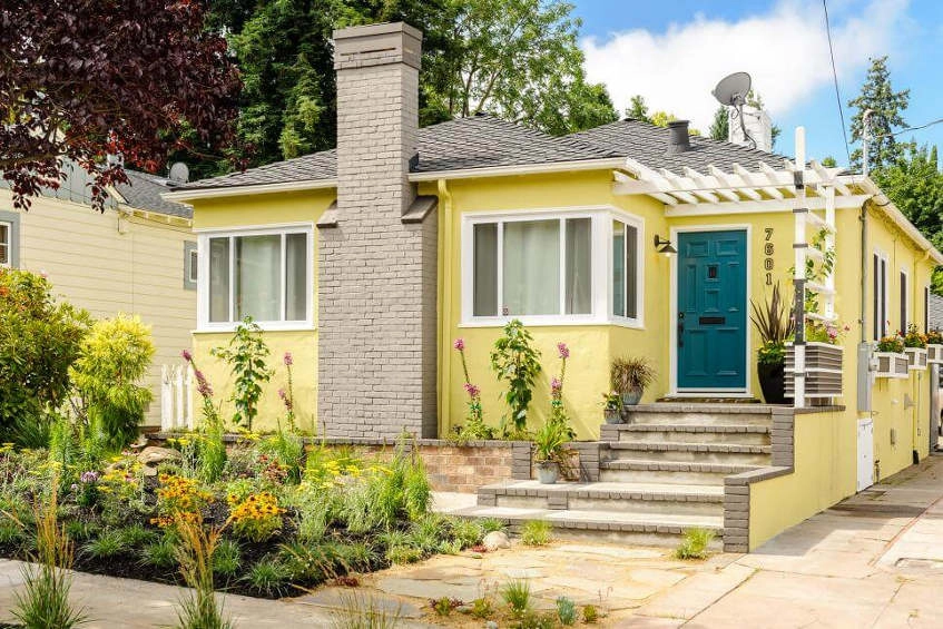 Pentru a da casei un aspect mai modern, combinați galbenul cu griul.